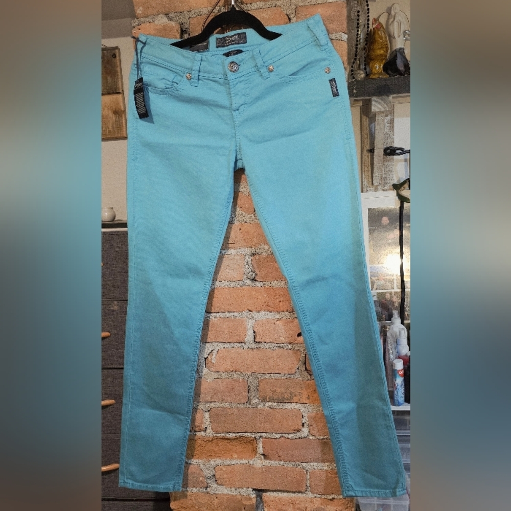 Silver Jeans Co. Aiko Skinny jeans in a vibrant teal or aqua color. (W27 / L31)